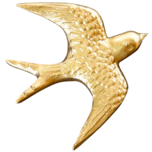 Pronssinen pääskynen hautakiveen
